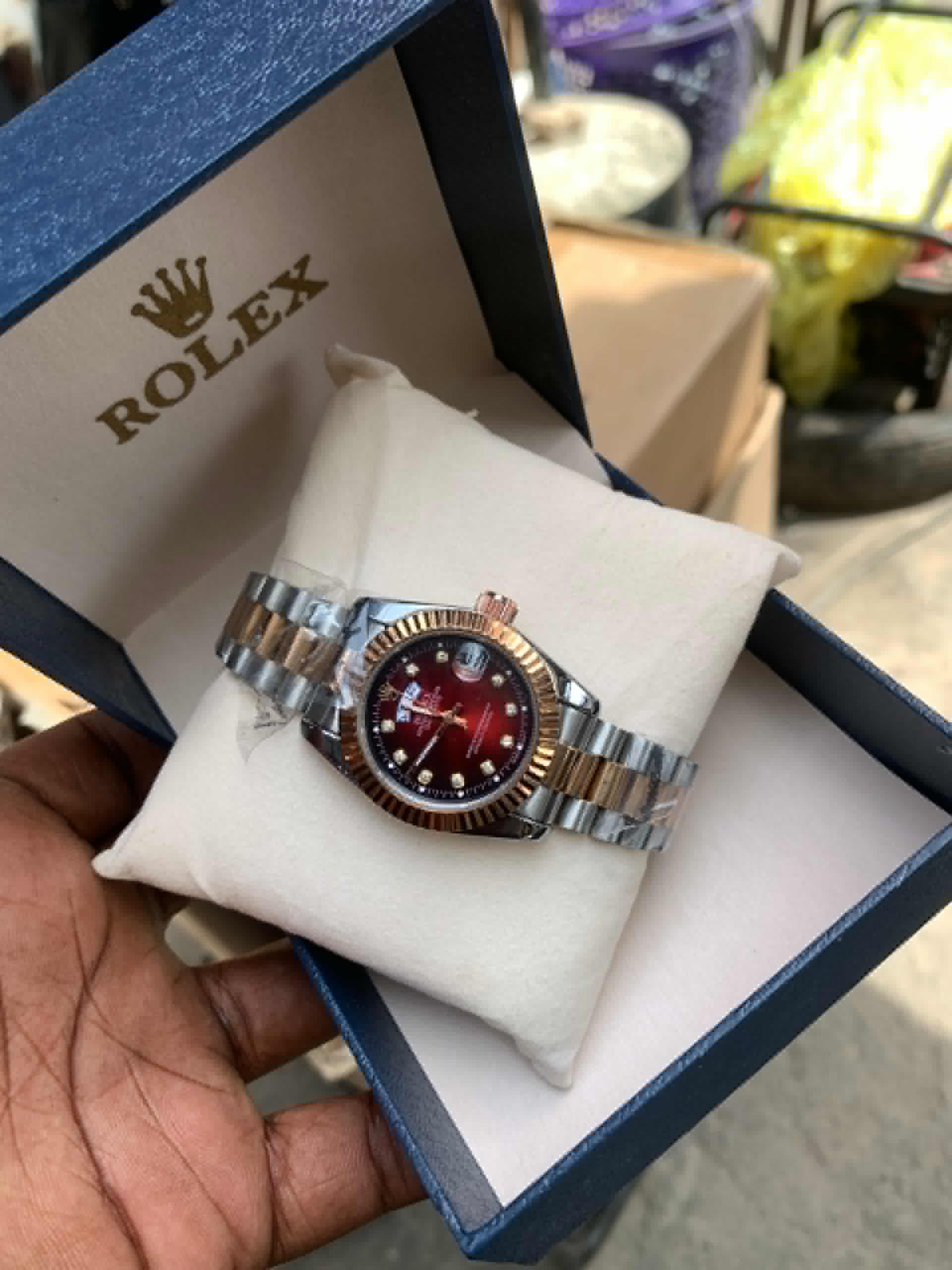 Chain-Strapped Female Rolex Wristwatch